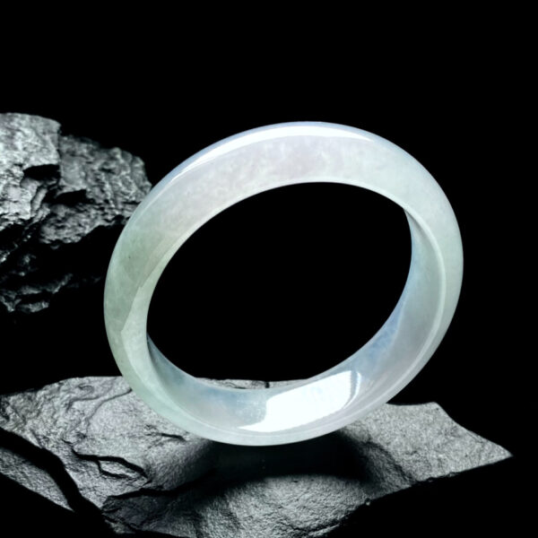 Side view of 57.4mm icy Qing Shui white jade bracelets