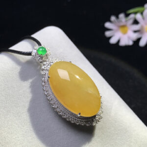front view of 18K yellow jade cabochon pendant