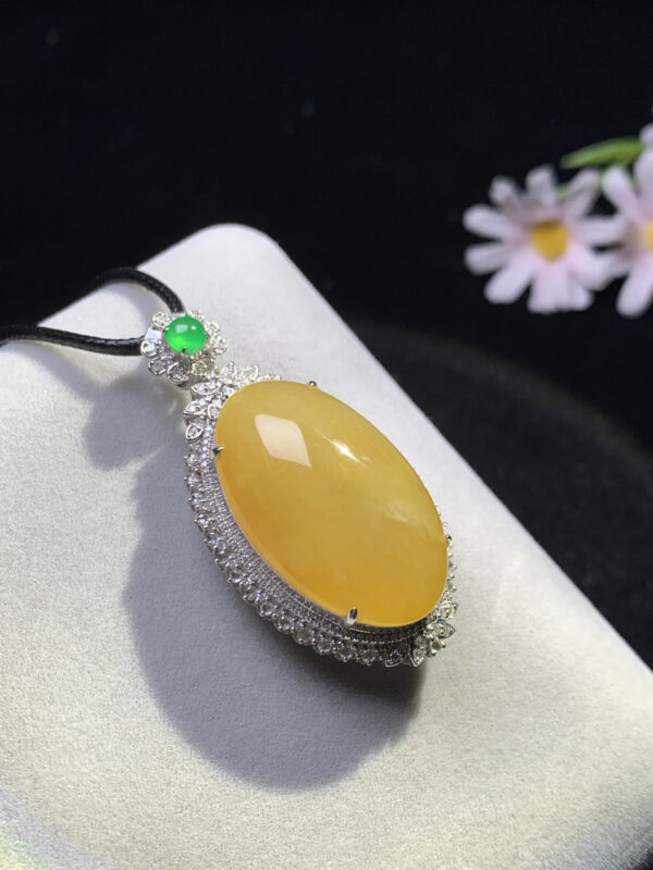front view of 18K yellow jade cabochon pendant