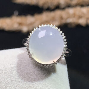 Front view of 18K white ice jadeite ring with oval cabochon gemstone