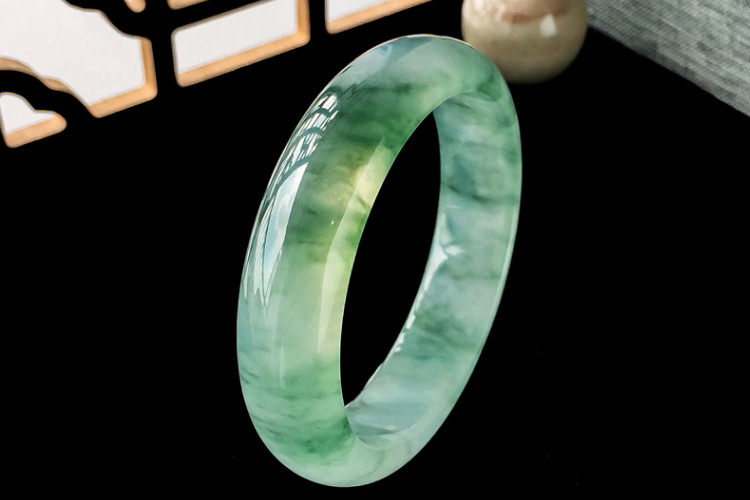 Close-up of a natural Chinese jade bracelet with smooth translucent green jade beads