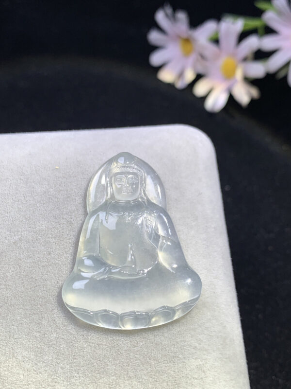 High-ice white jade Buddha pendant front view showing minimalist Guanyin carving