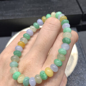 Close-up of 7.5mm coloured jade abacus bead bracelet showing vibrant multi-coloured jadeite beads