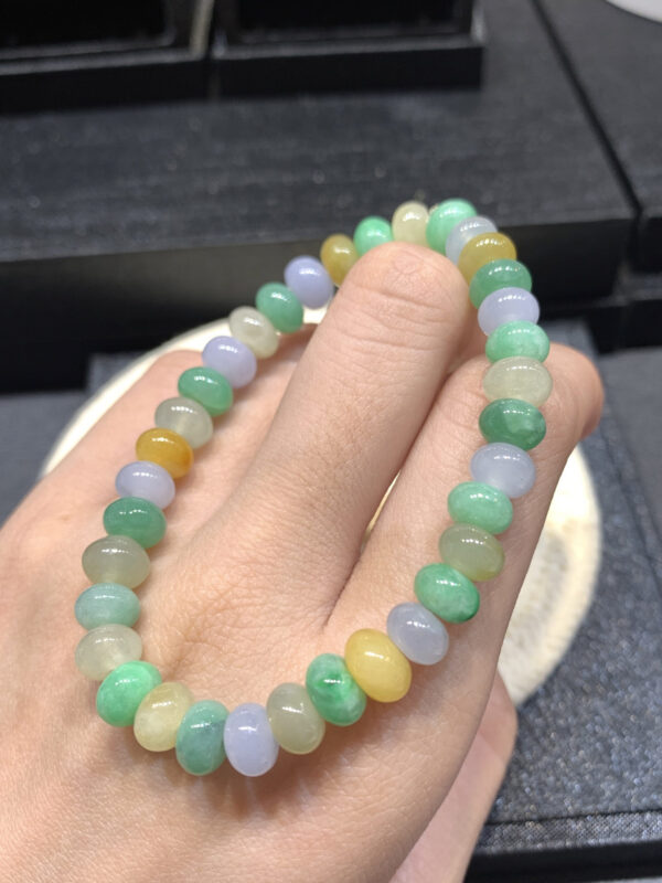 Close-up of 7.5mm coloured jade abacus bead bracelet showing vibrant multi-coloured jadeite beads