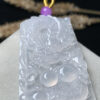 High-ice dragon jade pendant close-up showing intricate carving details