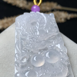 High-ice dragon jade pendant close-up showing intricate carving details