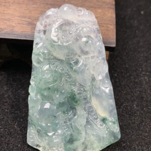 Natural jadeite dragon pendant with icy white base and floral patterns, measuring 59.5×37.5×6.3mm, exquisite dragon jewelry carving.