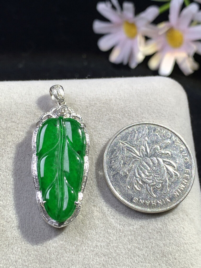 Woman wearing a polished green jade bracelet on her wrist
