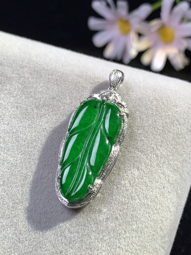 Raw green jade stone with vibrant emerald color