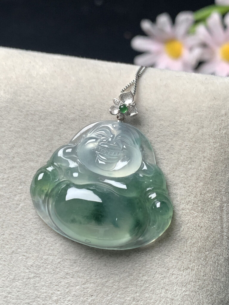 Ice green jade Buddha pendant hanging on silver chain
