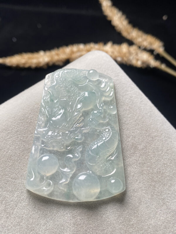 Icy jade dragon necklace close-up showing intricate dragon carving