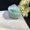 Back view of icy jade Pixiu pendant showing smooth jade surface