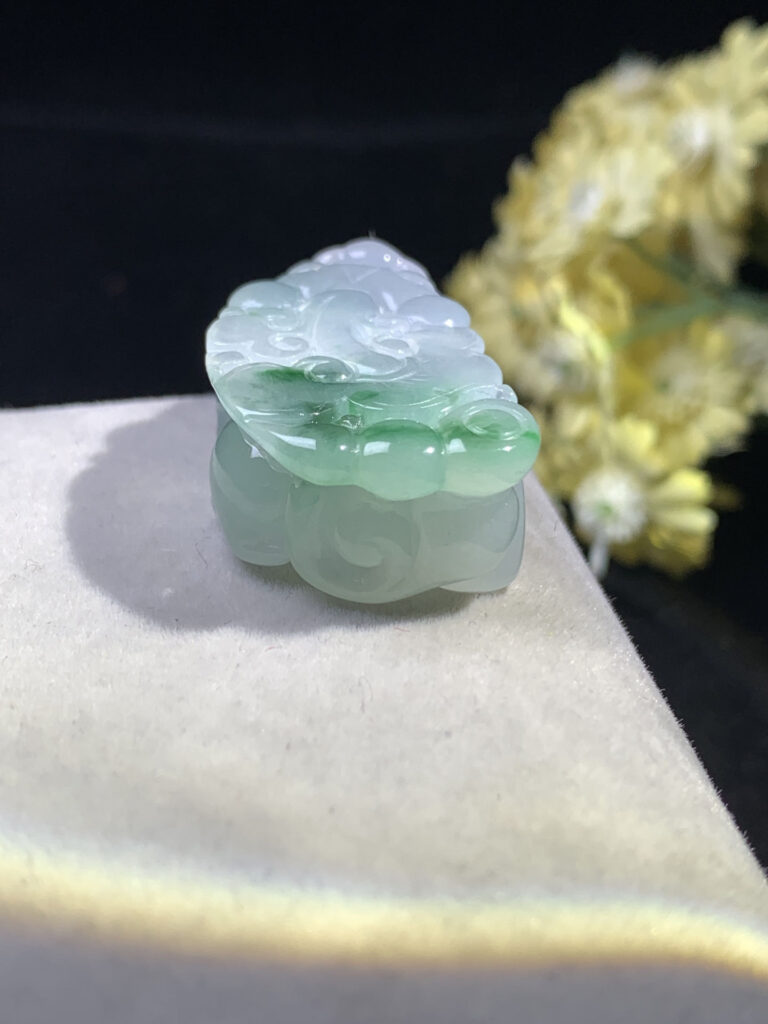 Back view of icy jade Pixiu pendant showing smooth jade surface