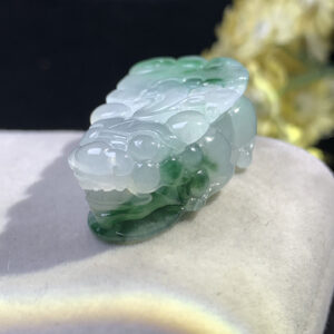 Front view of icy jade Pixiu pendant with floating green patterns