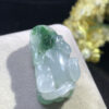 Icy jade Pixiu pendant worn on a red silk cord necklace