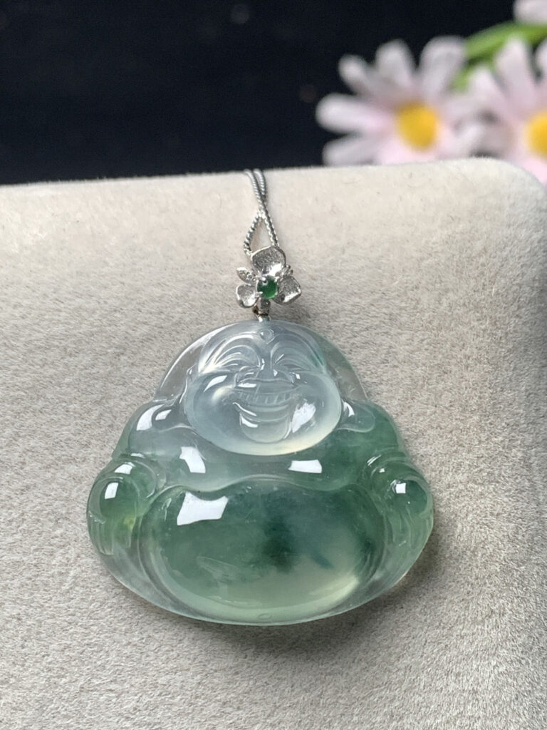 Side profile of jade Buddha necklace displaying smooth texture and depth