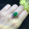 Jade rings worn on hand with imperial green stone and gold band