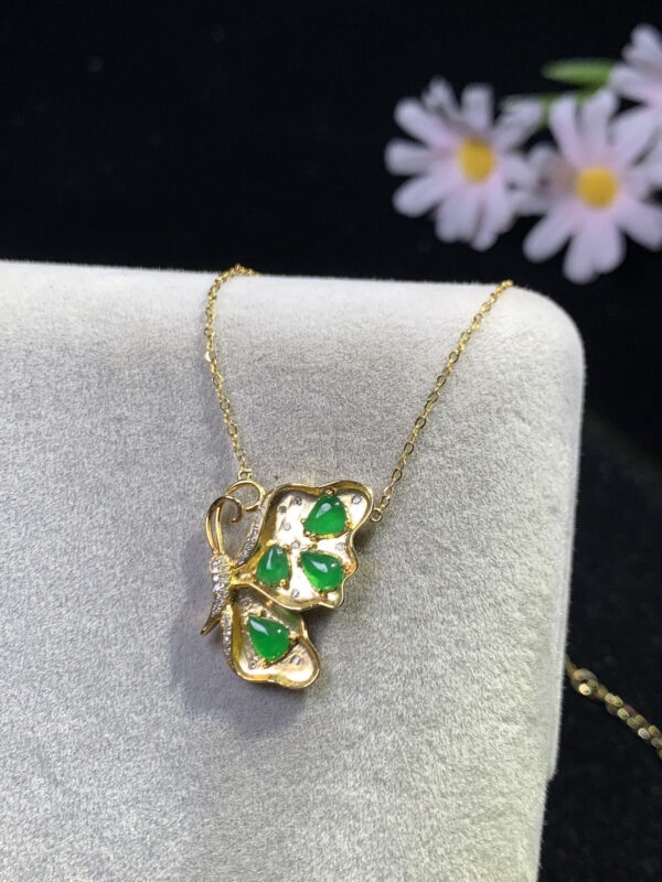 Close-up of butterfly pendant with teardrop high-ice green jadeite stones