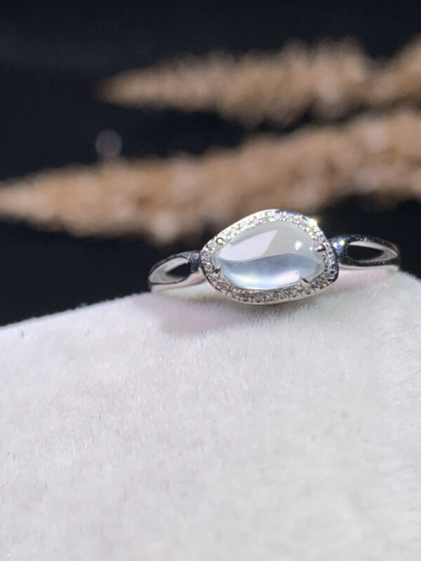 Jadeite stone ring with white icy cabochon in 18K gold, front view