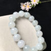 Stylish wrist wearing 13mm white jadeite beads bracelet with ice elastic cord, showcasing natural translucent jade colors