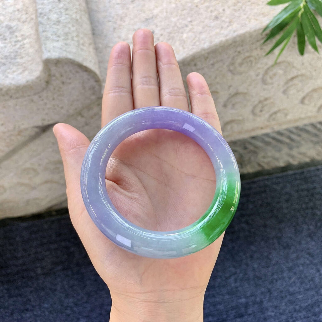 Polished lavender jade stone with soft pastel hues, representing one of the valuable colours influencing how much is a jade stone worth